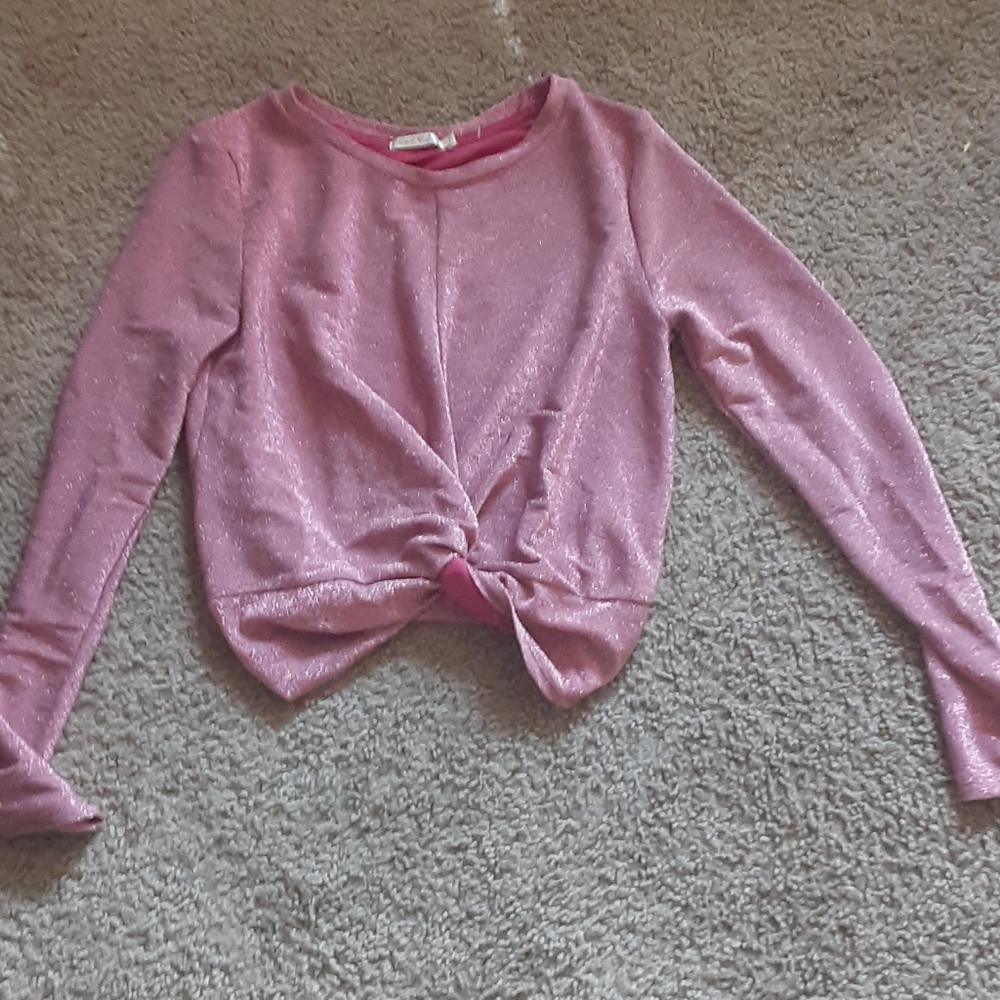A sparkly pink shirt crop topped